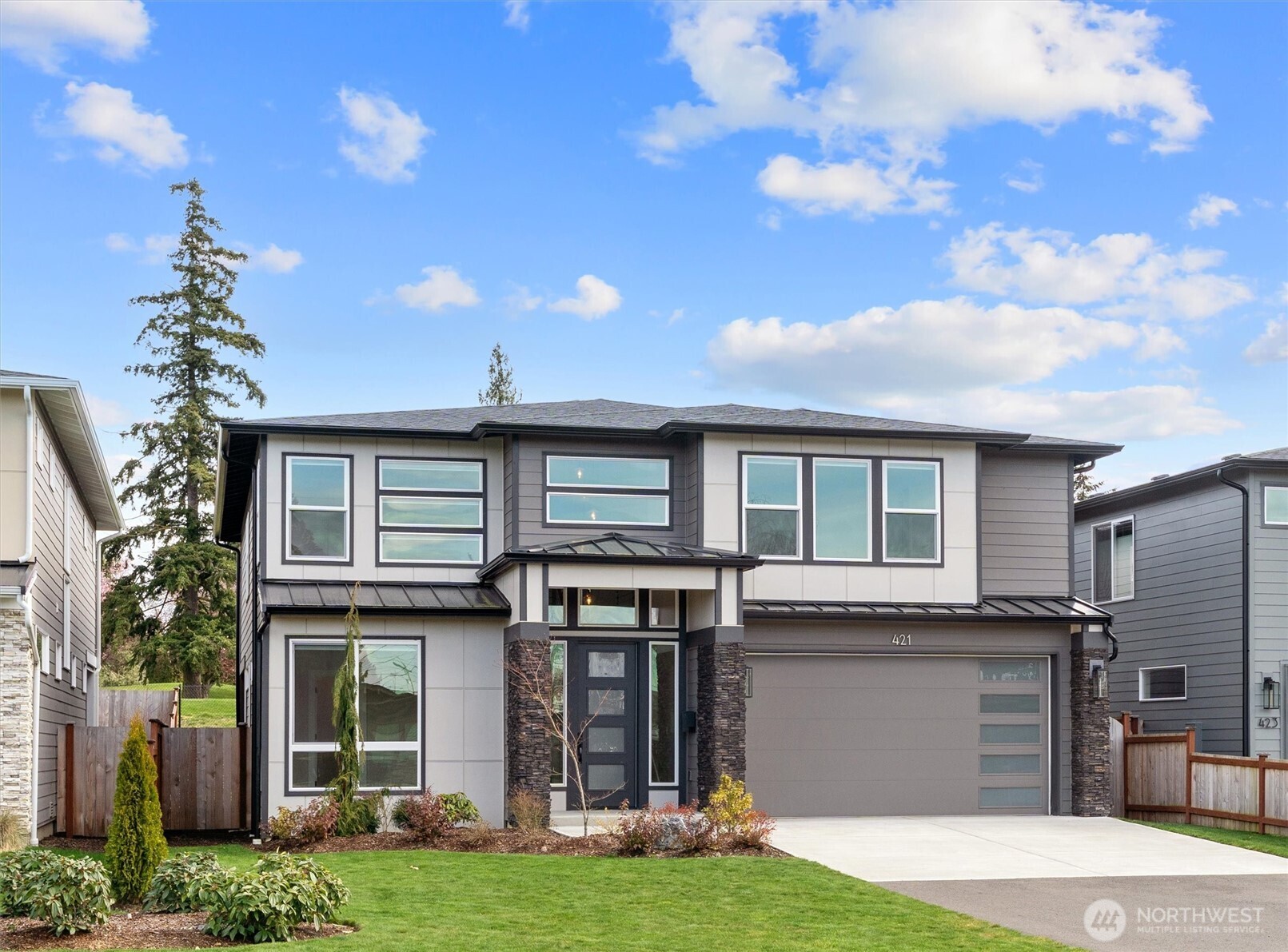 421 Rockefeller Avenue Everett, WA 98201 - Photo 3 of 40 a front view of a house with a yard and garage