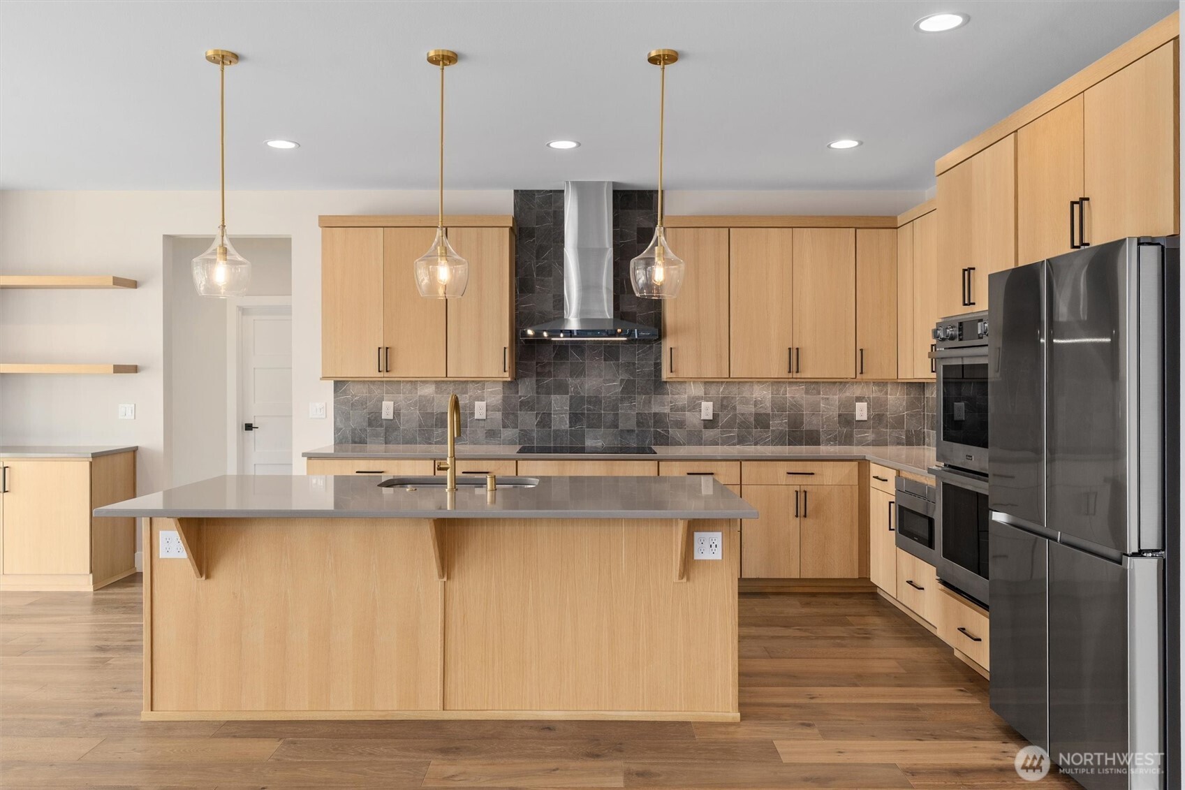 421 Rockefeller Avenue Everett, WA 98201 - Photo 5 of 40 a kitchen with stainless steel appliances granite countertop a refrigerator a sink a stove and a wooden floors