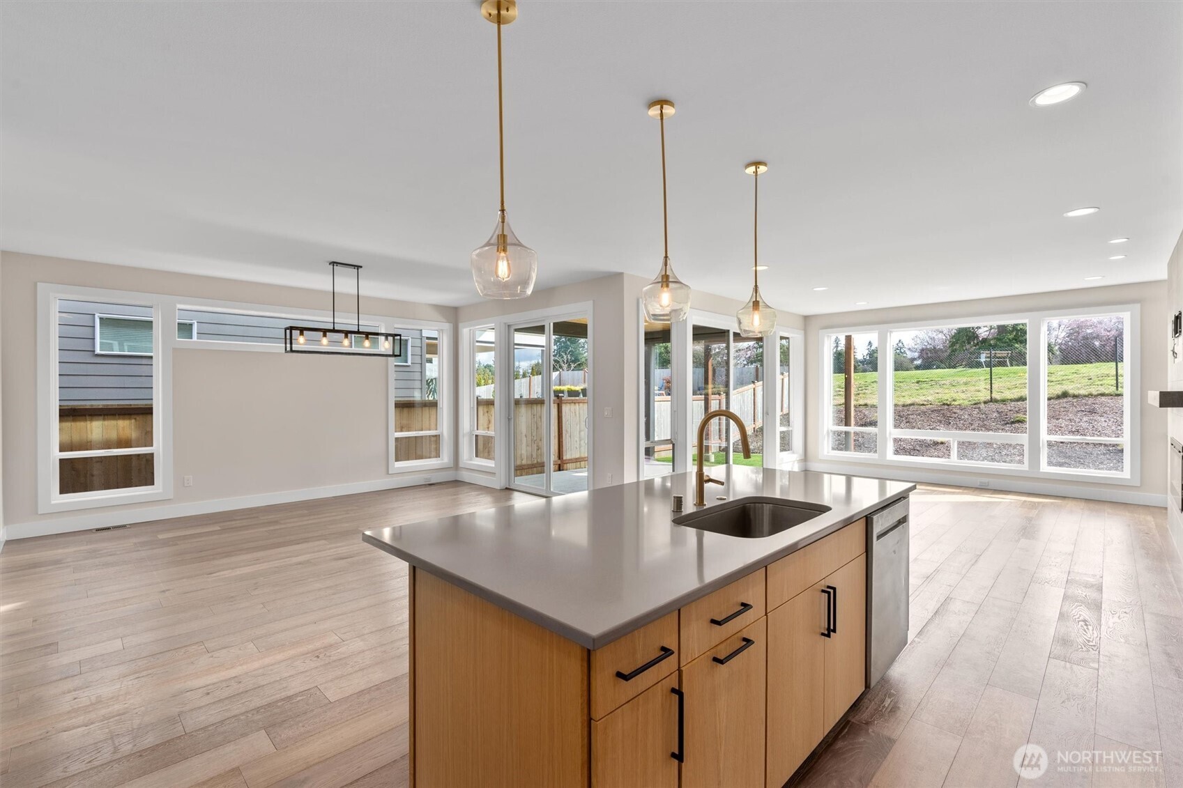 421 Rockefeller Avenue Everett, WA 98201 - Photo 7 of 40 a kitchen with stainless steel appliances granite countertop a sink a oven and a large window