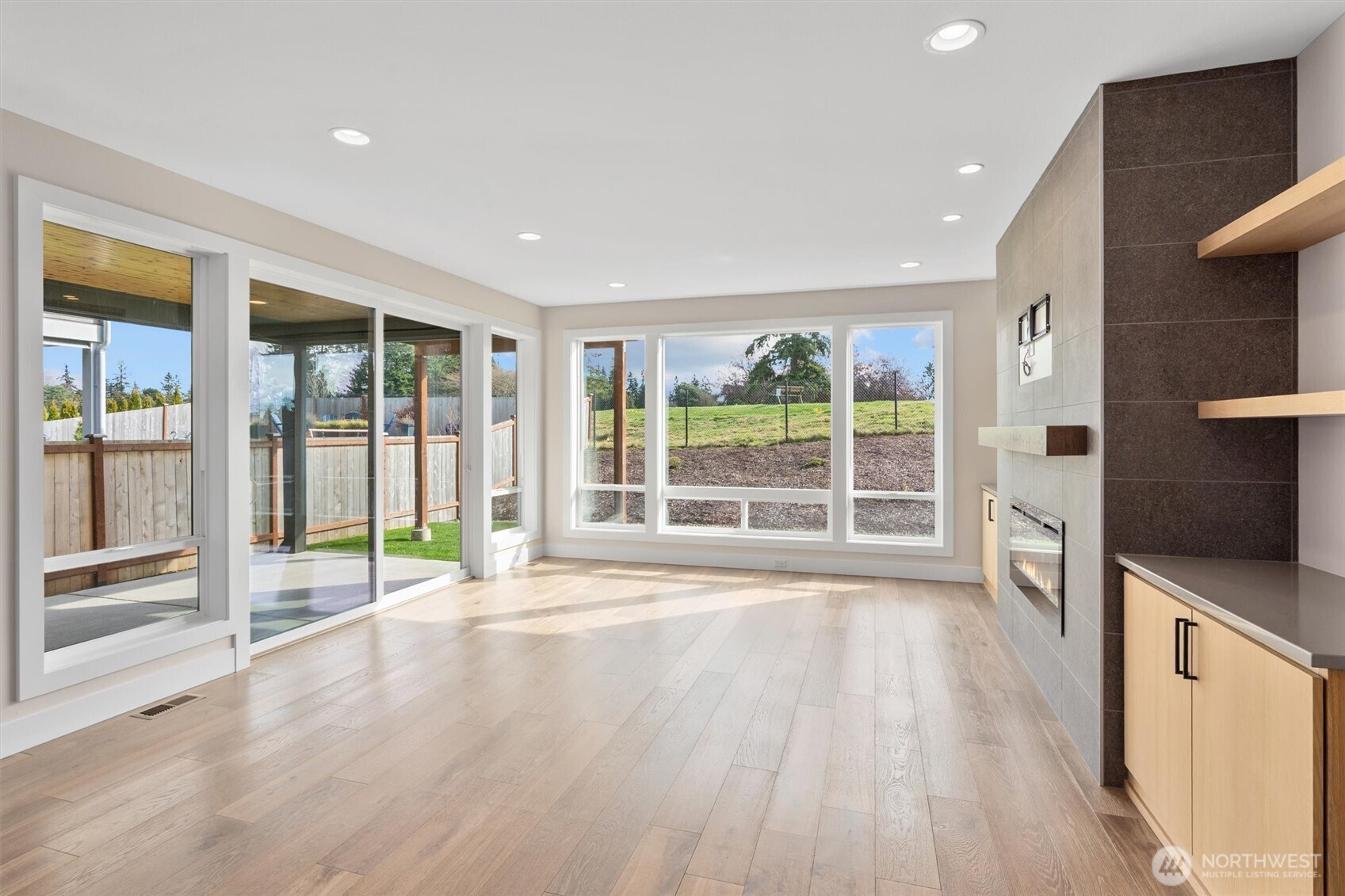 421 Rockefeller Avenue Everett, WA 98201 - Photo 10 of 40 a view of an empty room with wooden floor and a window