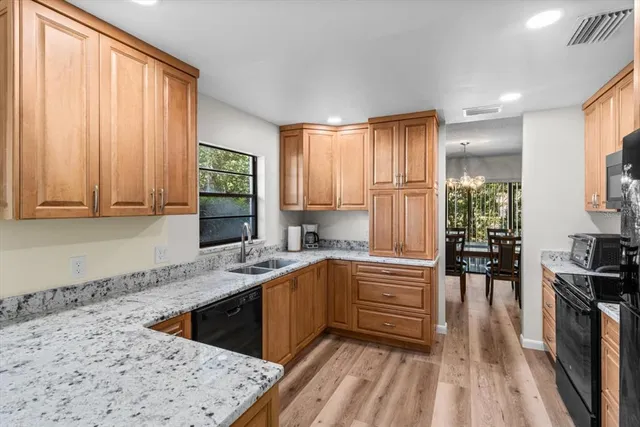 a bedroom with a bed and a night stand