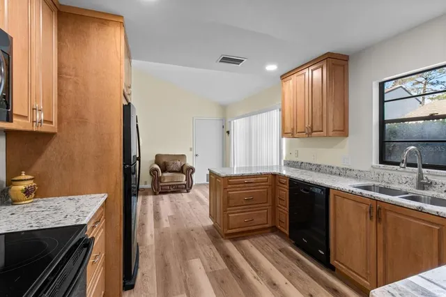 a kitchen with a sink and a window