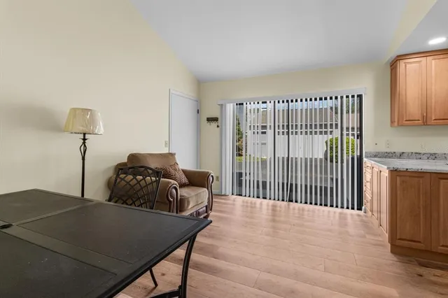 a kitchen with granite countertop a stove and a microwave