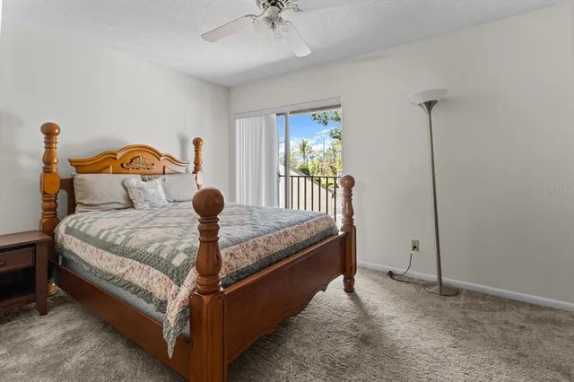 a view of a balcony with flower plants