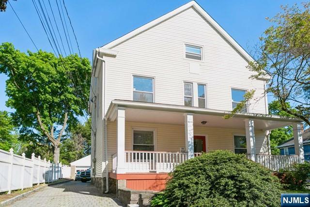 332 Closter Dock Road, Unit 1 Closter, NJ 07624 - Photo 1 of 21 a view of a house with a yard