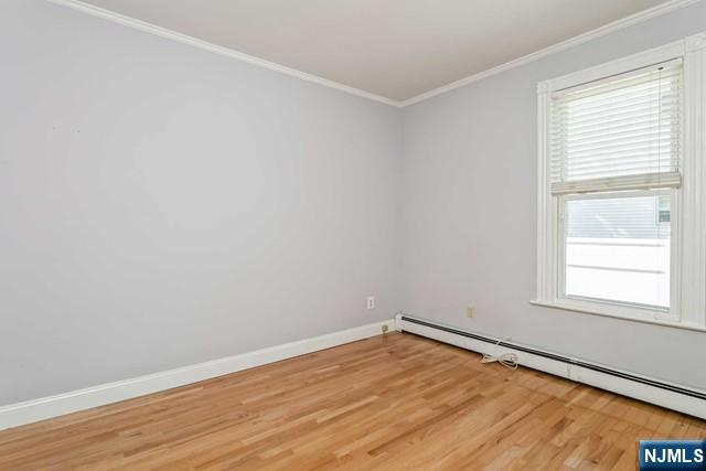 332 Closter Dock Road, Unit 1 Closter, NJ 07624 - Photo 11 of 21 an empty room with wooden floor and windows