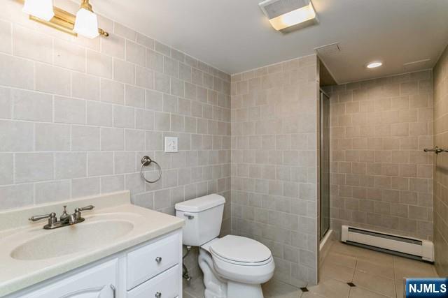332 Closter Dock Road, Unit 1 Closter, NJ 07624 - Photo 15 of 21 a bathroom with a sink toilet and shower