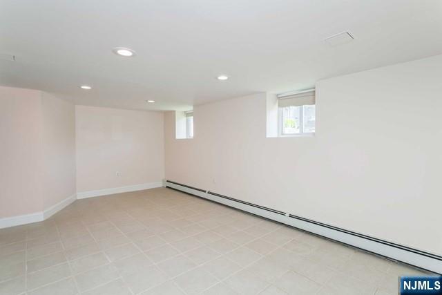 332 Closter Dock Road, Unit 1 Closter, NJ 07624 - Photo 16 of 21 an empty room with a workbench