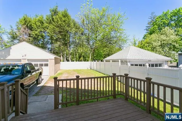 a view of a house with wooden deck