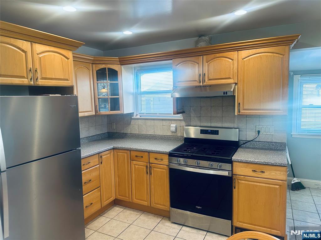 332 Closter Dock Road, Unit 1 Closter, NJ 07624 - Photo 2 of 21 a kitchen with stainless steel appliances granite countertop a refrigerator a sink dishwasher with a cabinets and wooden floor