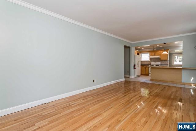 332 Closter Dock Road, Unit 1 Closter, NJ 07624 - Photo 7 of 21 a view of empty room with wooden floor and a window