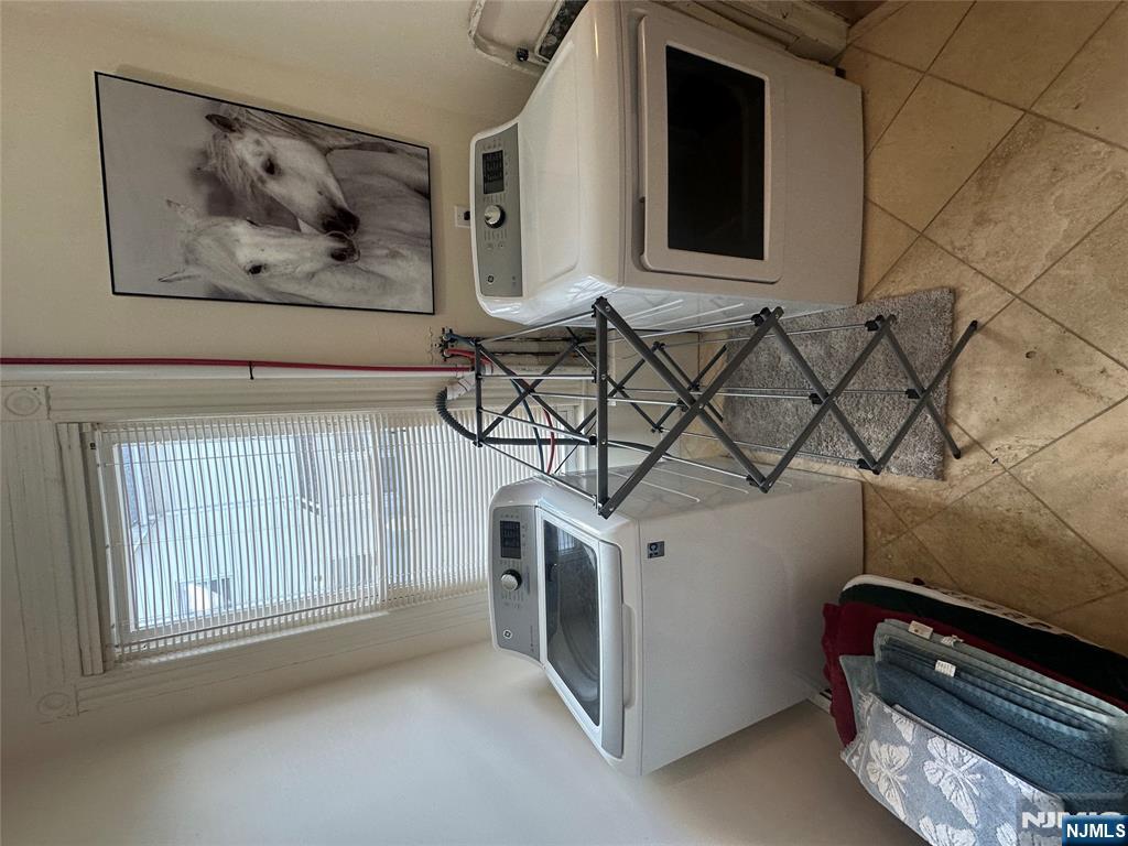 332 Closter Dock Road, Unit 1 Closter, NJ 07624 - Photo 10 of 21 a bathroom with a sink and a mirror
