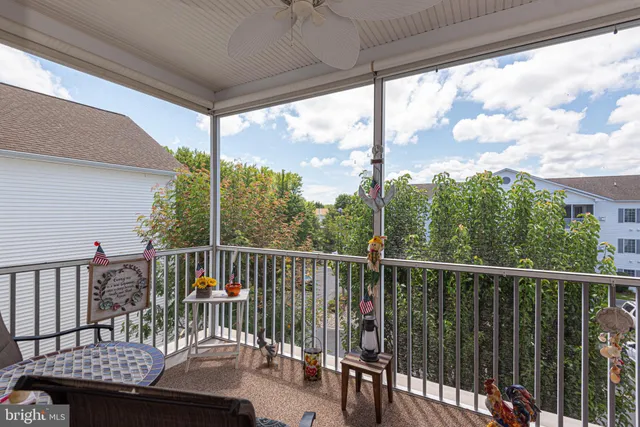 a view of a balcony with furniture