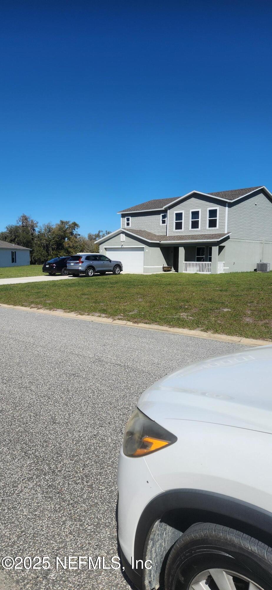427 River Hill Welaka, FL 32193 - Photo 11 of 15 a front view of a house with a yard