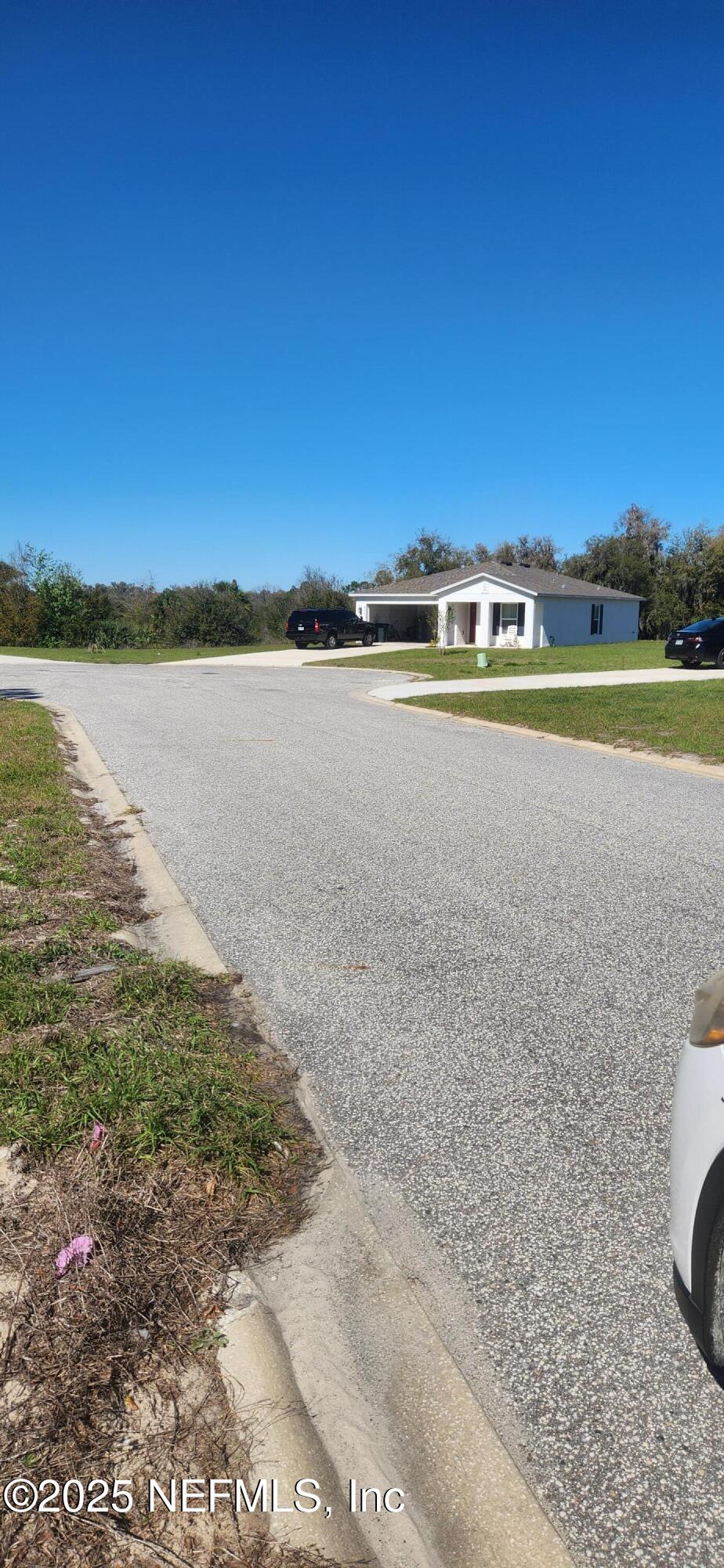 427 River Hill Welaka, FL 32193 - Photo 10 of 15 a view of a lake with a building in the background