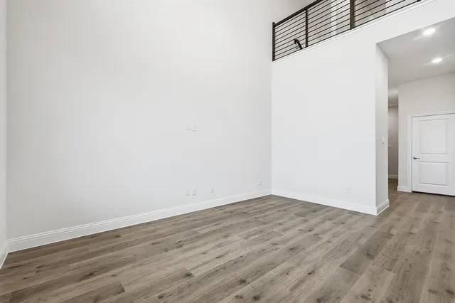 an empty room with wooden floor