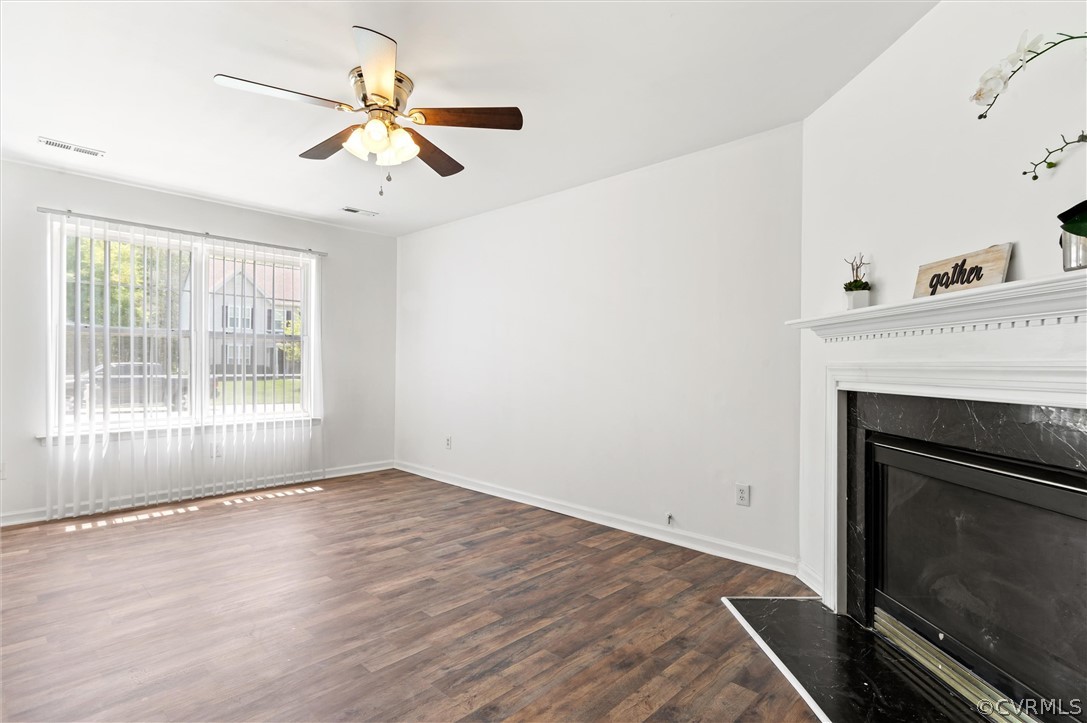 3030 Amherst Ridge Way Colonial Heights, VA 23834 - Photo 12 of 21 a view of an empty room with wooden floor and a fireplace