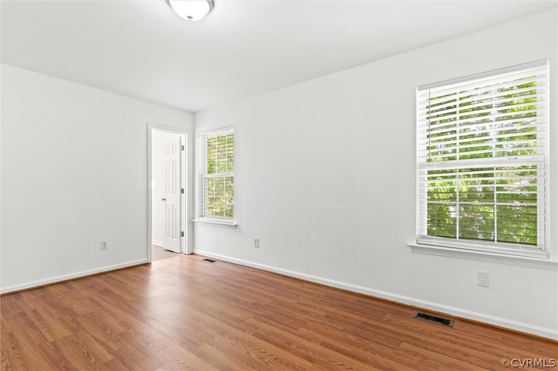 3030 Amherst Ridge Way Colonial Heights, VA 23834 - Photo 14 of 21 an empty room with wooden floor and windows