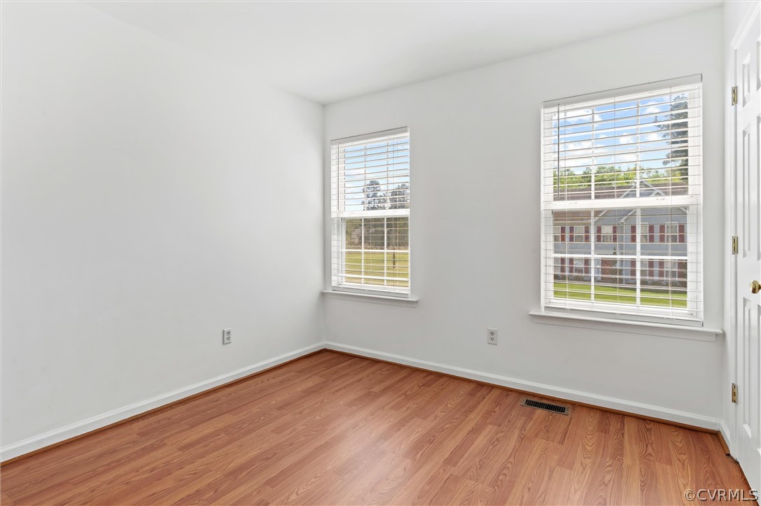 3030 Amherst Ridge Way Colonial Heights, VA 23834 - Photo 16 of 21 an empty room with wooden floor and windows