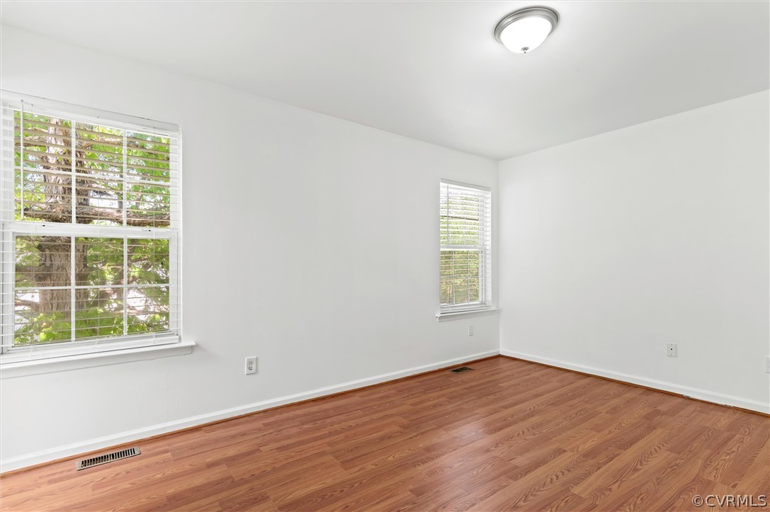 3030 Amherst Ridge Way Colonial Heights, VA 23834 - Photo 17 of 21 an empty room with wooden floor and windows