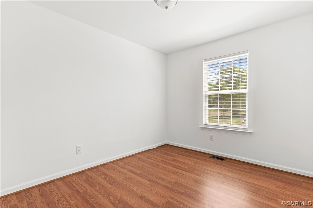 3030 Amherst Ridge Way Colonial Heights, VA 23834 - Photo 19 of 21 an empty room with wooden floor and windows