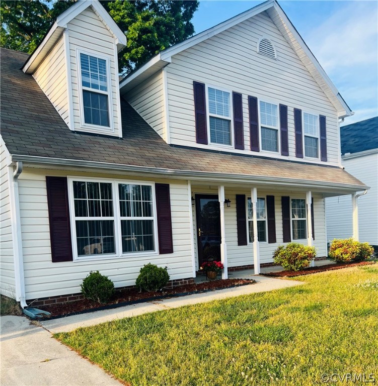 3030 Amherst Ridge Way Colonial Heights, VA 23834 - Photo 2 of 21 a view of a white house with large windows and plants