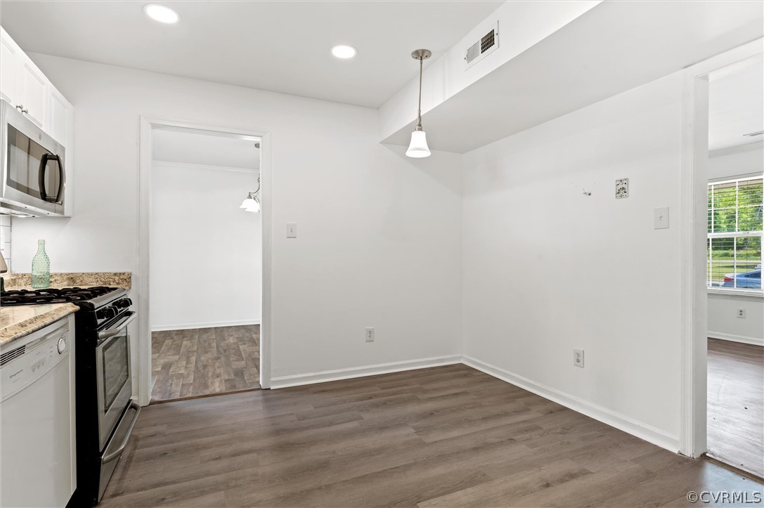 3030 Amherst Ridge Way Colonial Heights, VA 23834 - Photo 7 of 21 an empty room with wooden floor and stainless steel appliances