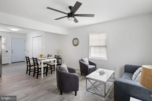 a view of a livingroom with furniture and a window