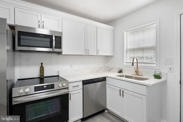 a kitchen with a stove and a microwave