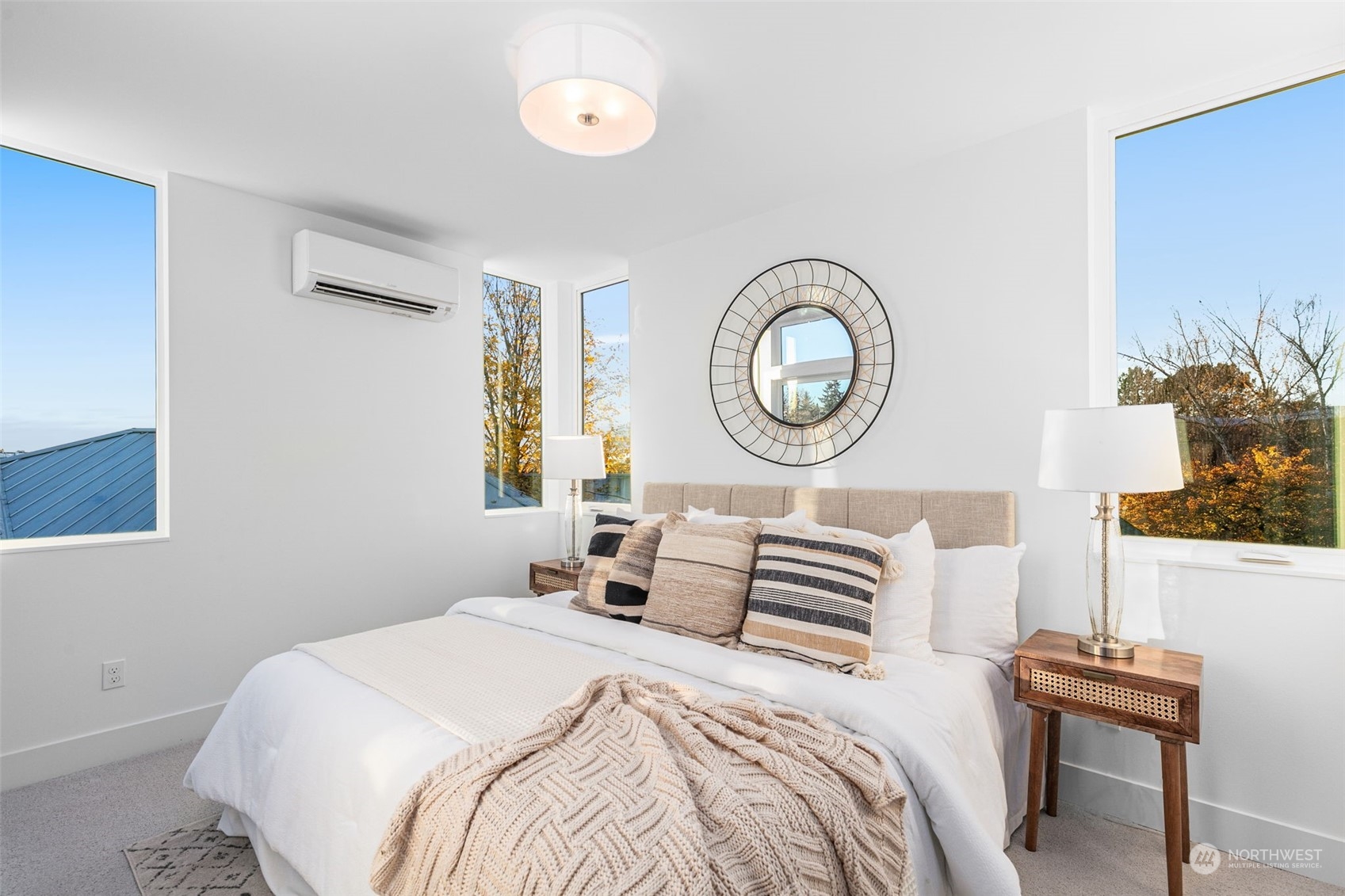 406 Northeast 75th Street Seattle, WA 98115 - Photo 11 of 29 a bedroom with a bed and a lamp on dresser
