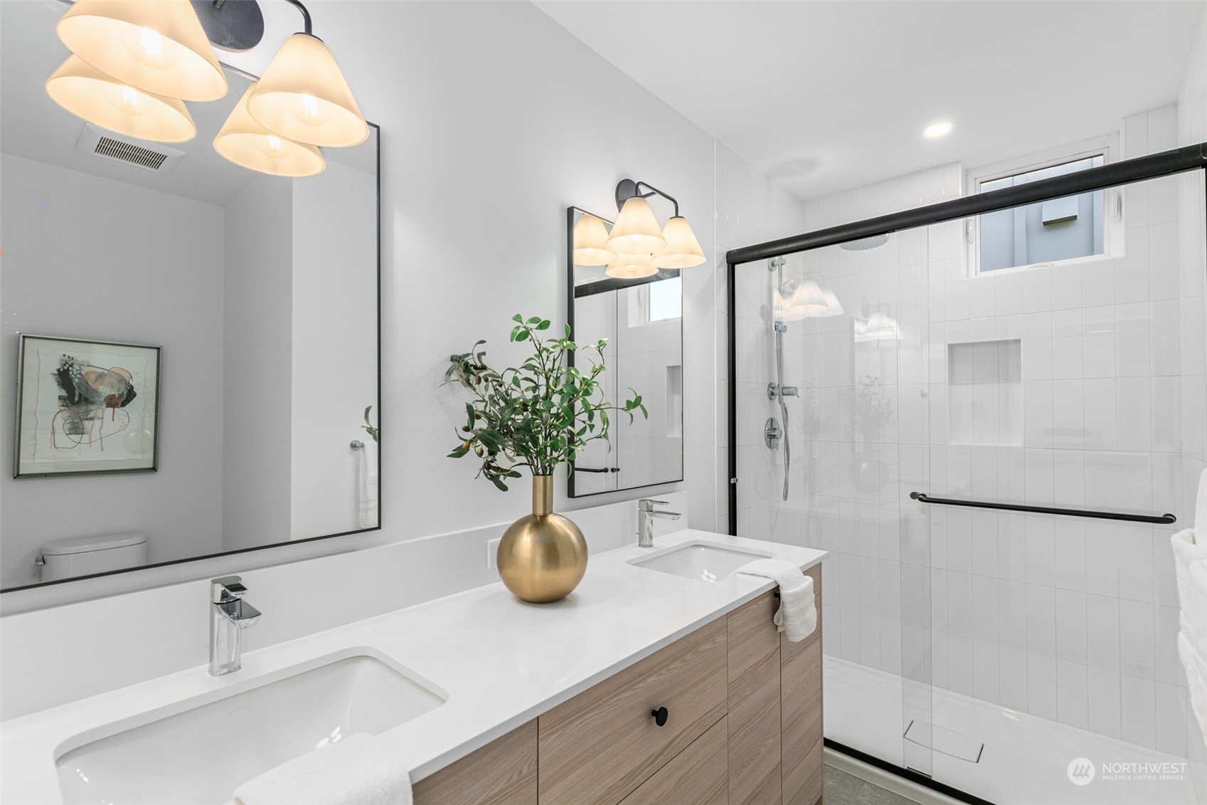 406 Northeast 75th Street Seattle, WA 98115 - Photo 13 of 29 a view of bathroom with a sink and mirror
