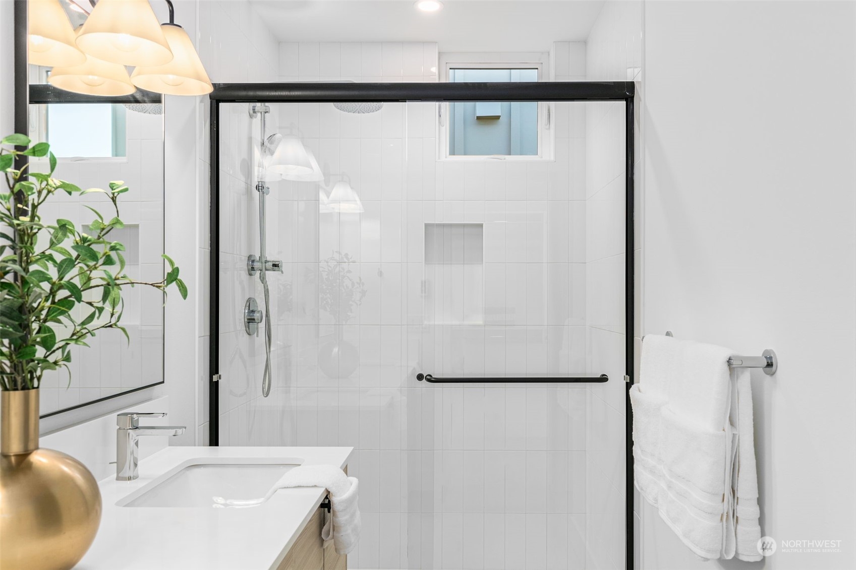 406 Northeast 75th Street Seattle, WA 98115 - Photo 14 of 29 a bathroom with a sink and a mirror