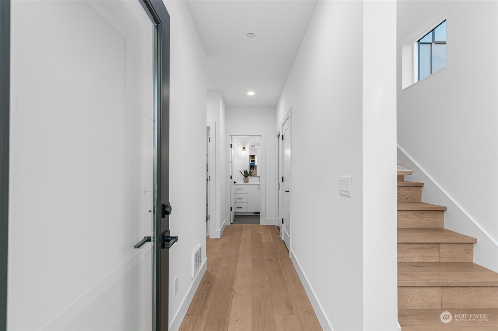 406 Northeast 75th Street Seattle, WA 98115 - Photo 3 of 29 a view of a hallway with white walls