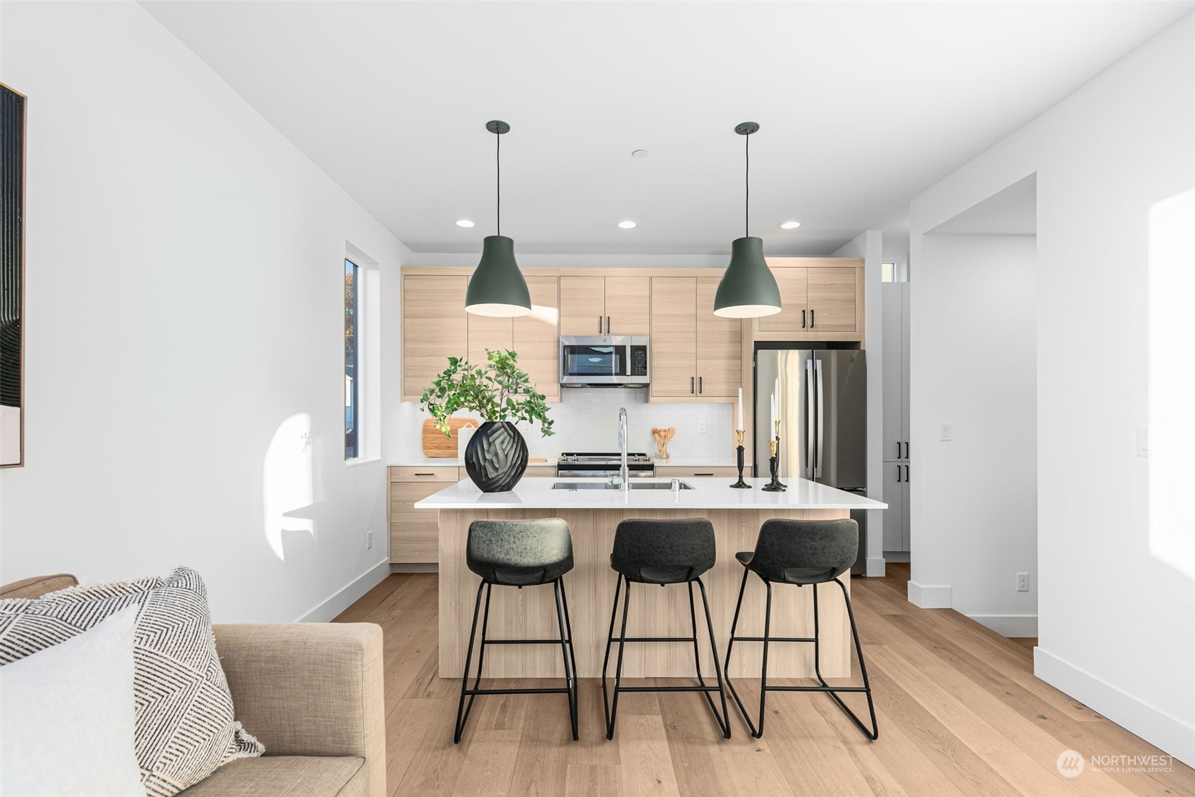 406 Northeast 75th Street Seattle, WA 98115 - Photo 7 of 29 a living room with furniture and a chandelier