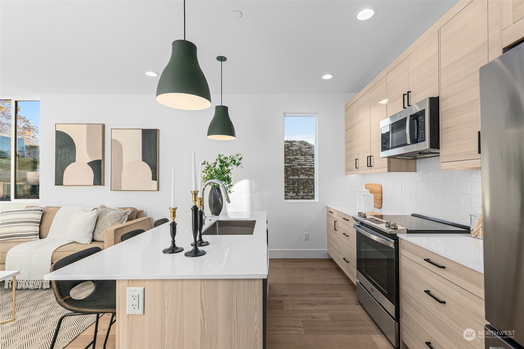 406 Northeast 75th Street Seattle, WA 98115 - Photo 10 of 29 a kitchen with granite countertop a sink stainless steel appliances and cabinets