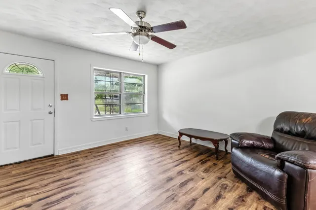 a living room with furniture and a window