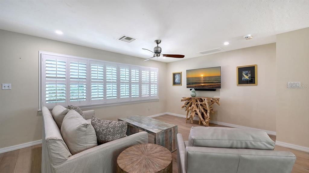 4810 Bay Shore Road Sarasota, FL 34234 - Photo 13 of 47 a living room with furniture and a flat screen tv