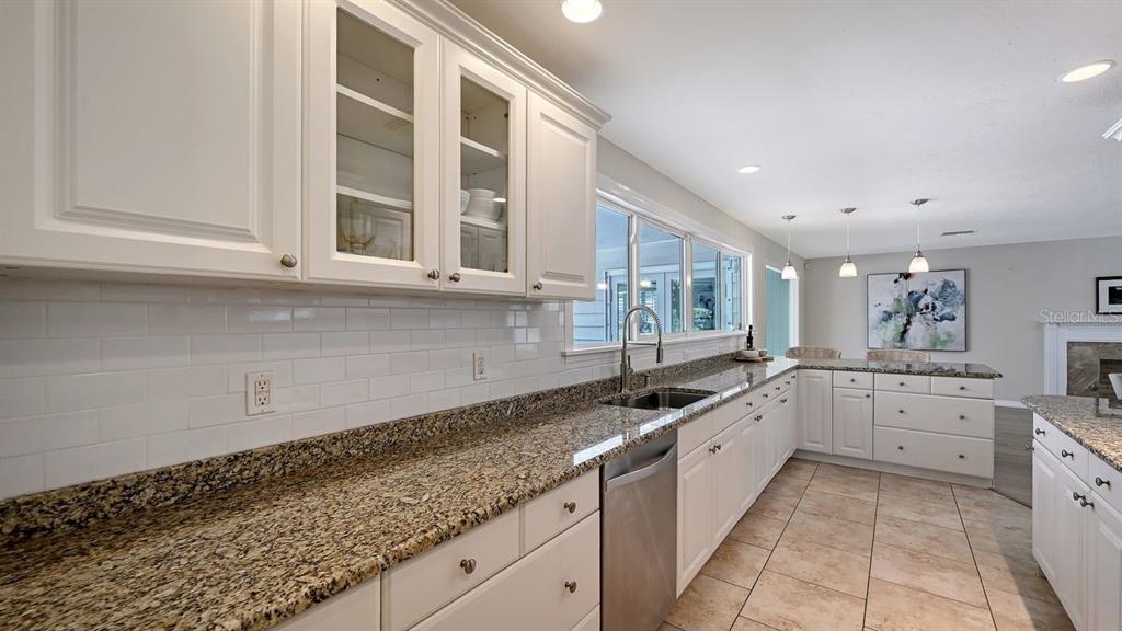 4810 Bay Shore Road Sarasota, FL 34234 - Photo 19 of 47 a large kitchen with granite countertop a sink