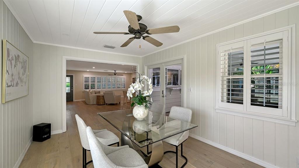 4810 Bay Shore Road Sarasota, FL 34234 - Photo 22 of 47 a dining room with furniture and window