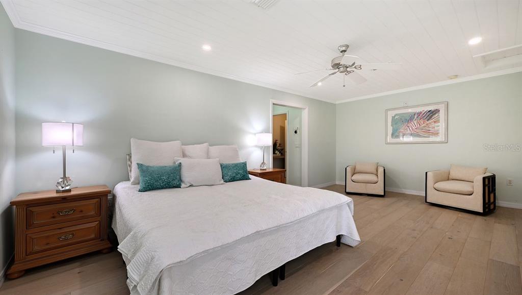 4810 Bay Shore Road Sarasota, FL 34234 - Photo 23 of 47 a bedroom with a bed and ceiling fan