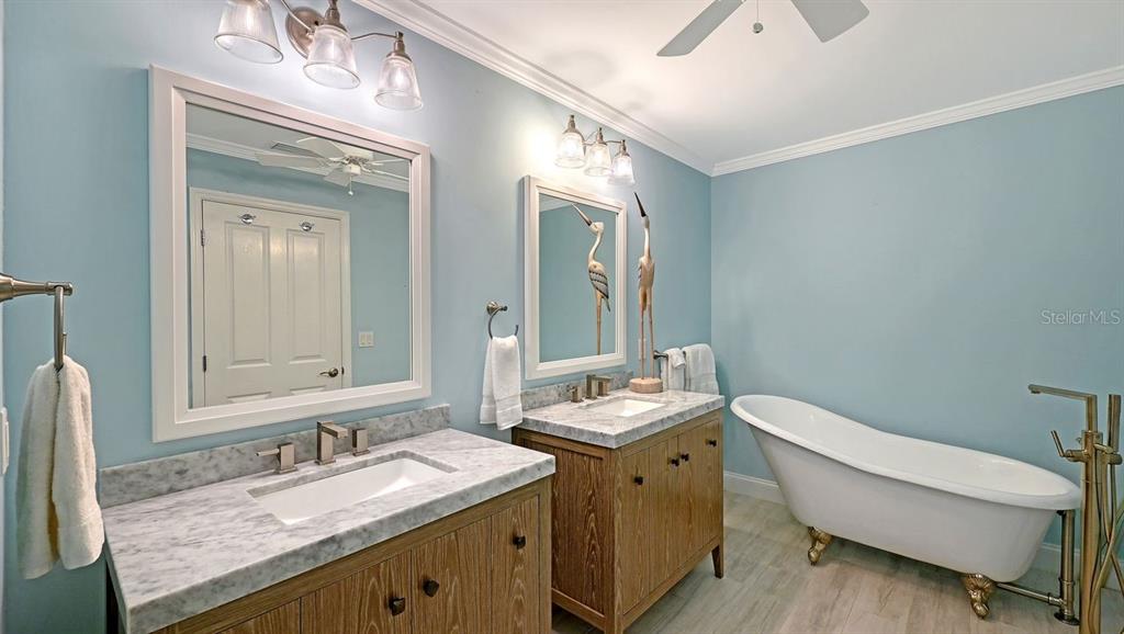4810 Bay Shore Road Sarasota, FL 34234 - Photo 25 of 47 a bathroom with a granite countertop sink mirror and toilet