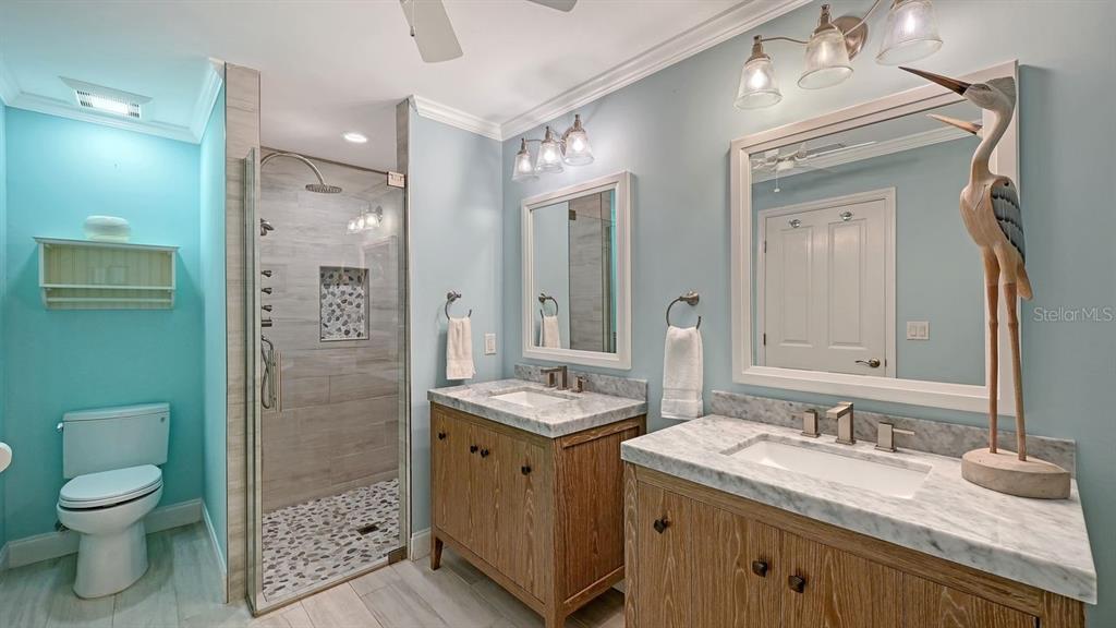 4810 Bay Shore Road Sarasota, FL 34234 - Photo 26 of 47 a bathroom with a granite countertop sink toilet and shower