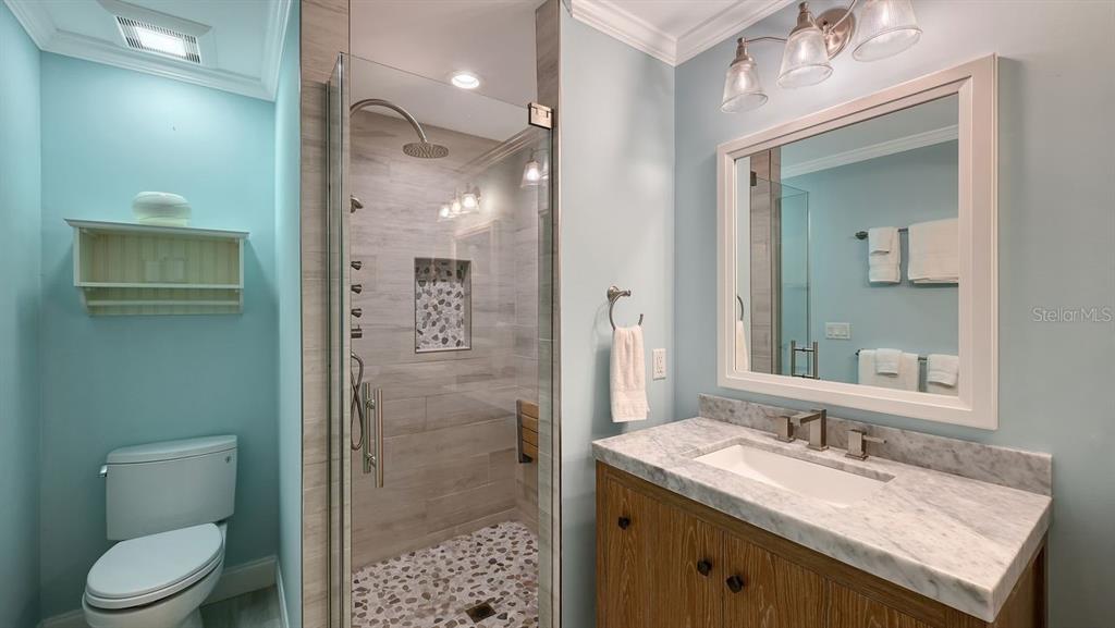 4810 Bay Shore Road Sarasota, FL 34234 - Photo 27 of 47 a bathroom with a granite countertop sink toilet and shower