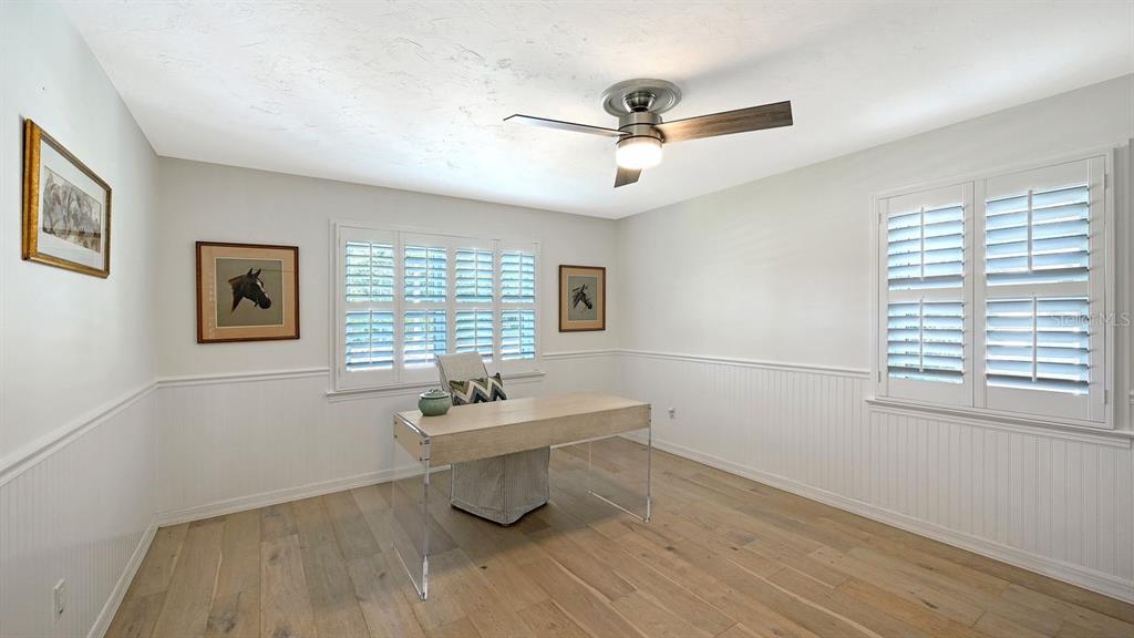 4810 Bay Shore Road Sarasota, FL 34234 - Photo 30 of 47 a view of a room with wooden floor fan and windows