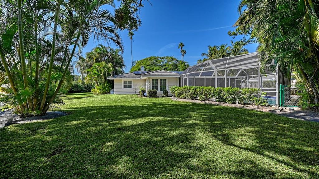 4810 Bay Shore Road Sarasota, FL 34234 - Photo 44 of 47 a view of house with yard and green space