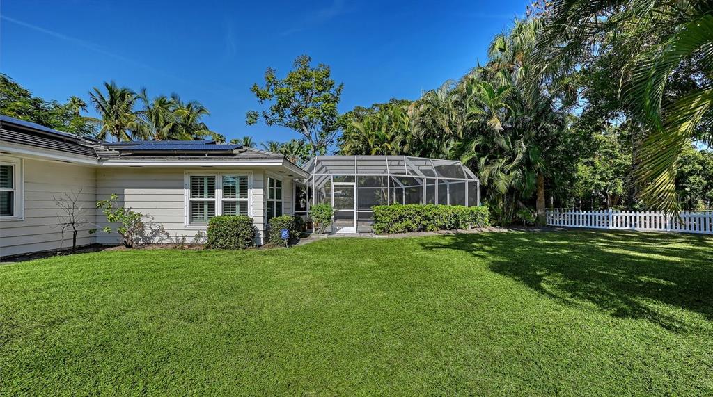 4810 Bay Shore Road Sarasota, FL 34234 - Photo 45 of 47 a front view of a house with a garden