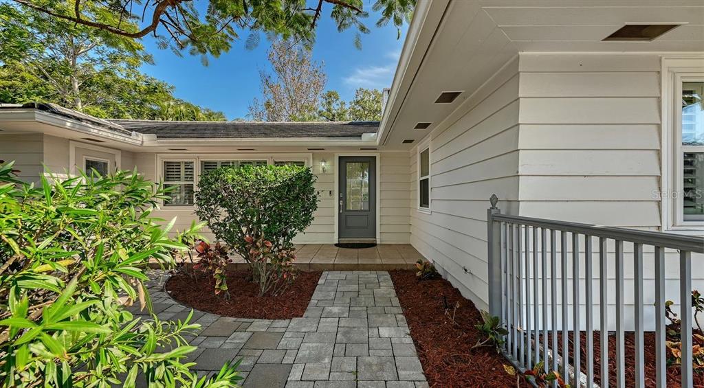 4810 Bay Shore Road Sarasota, FL 34234 - Photo 8 of 47 a view of a backyard with potted plants
