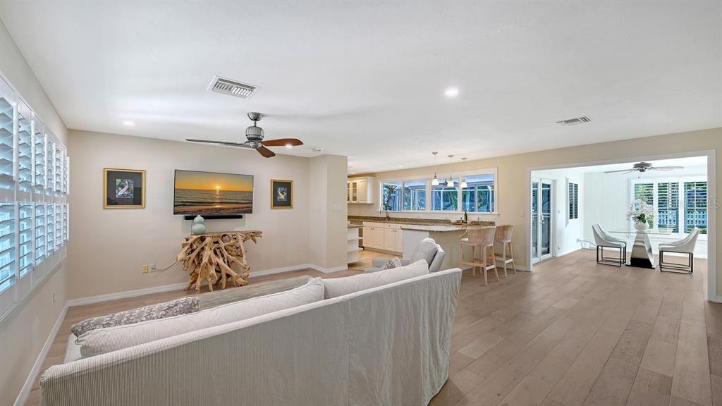 4810 Bay Shore Road Sarasota, FL 34234 - Photo 10 of 47 a living room with furniture and a flat screen tv