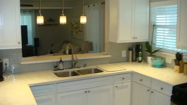 a kitchen with a sink and cabinets