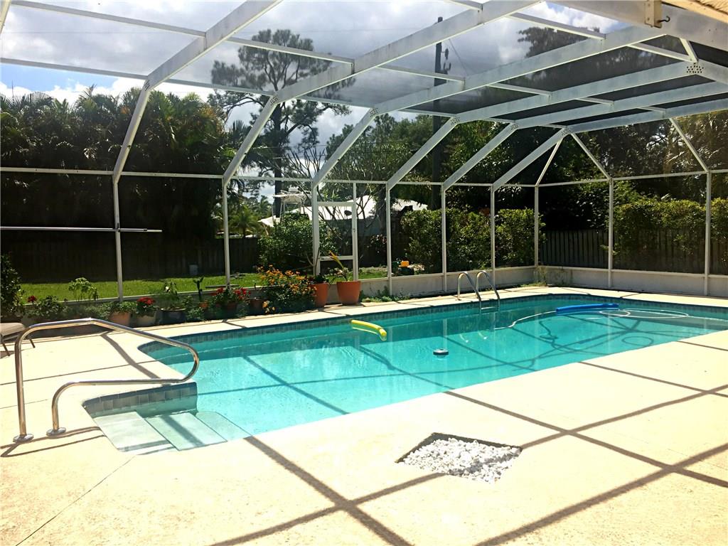1674 Northwest Spruce Ridge Drive Stuart, FL 34994 - Photo 8 of 9 a view of a room with gym equipment